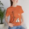 Companionship Under the Moon Tee (Dog/Cat Sitting, Moon Graphic) — Humor by M · Art & Design